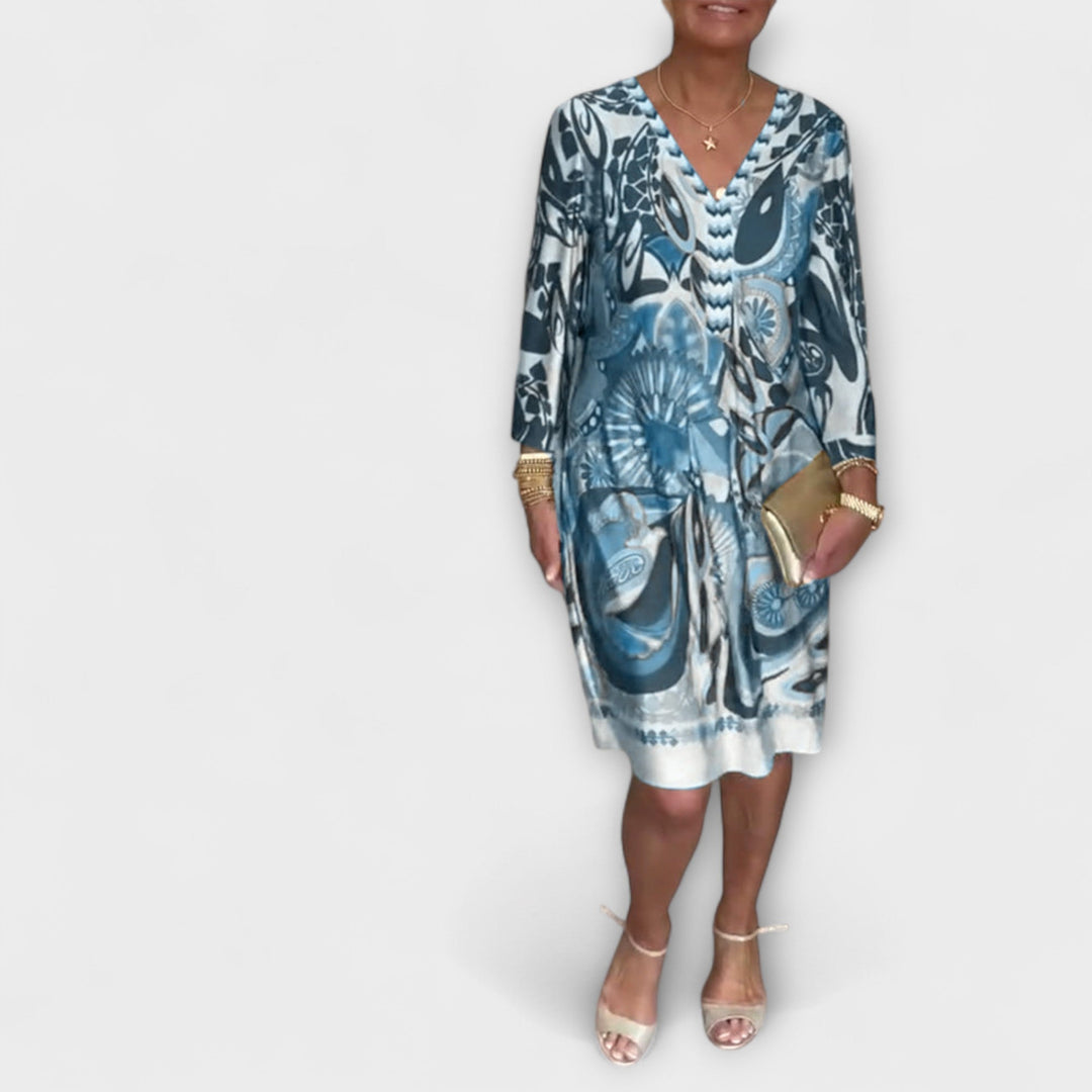 V-hals uvolněné šaty s retro potiskem